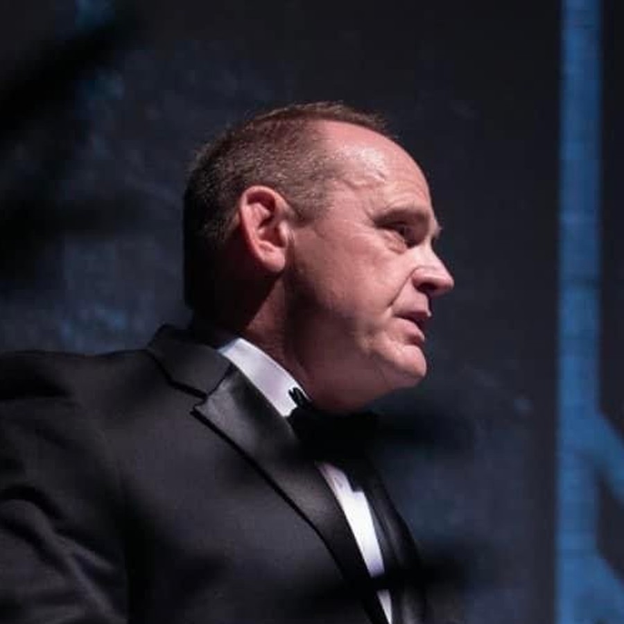 Dave Ogden speaking at a formal event