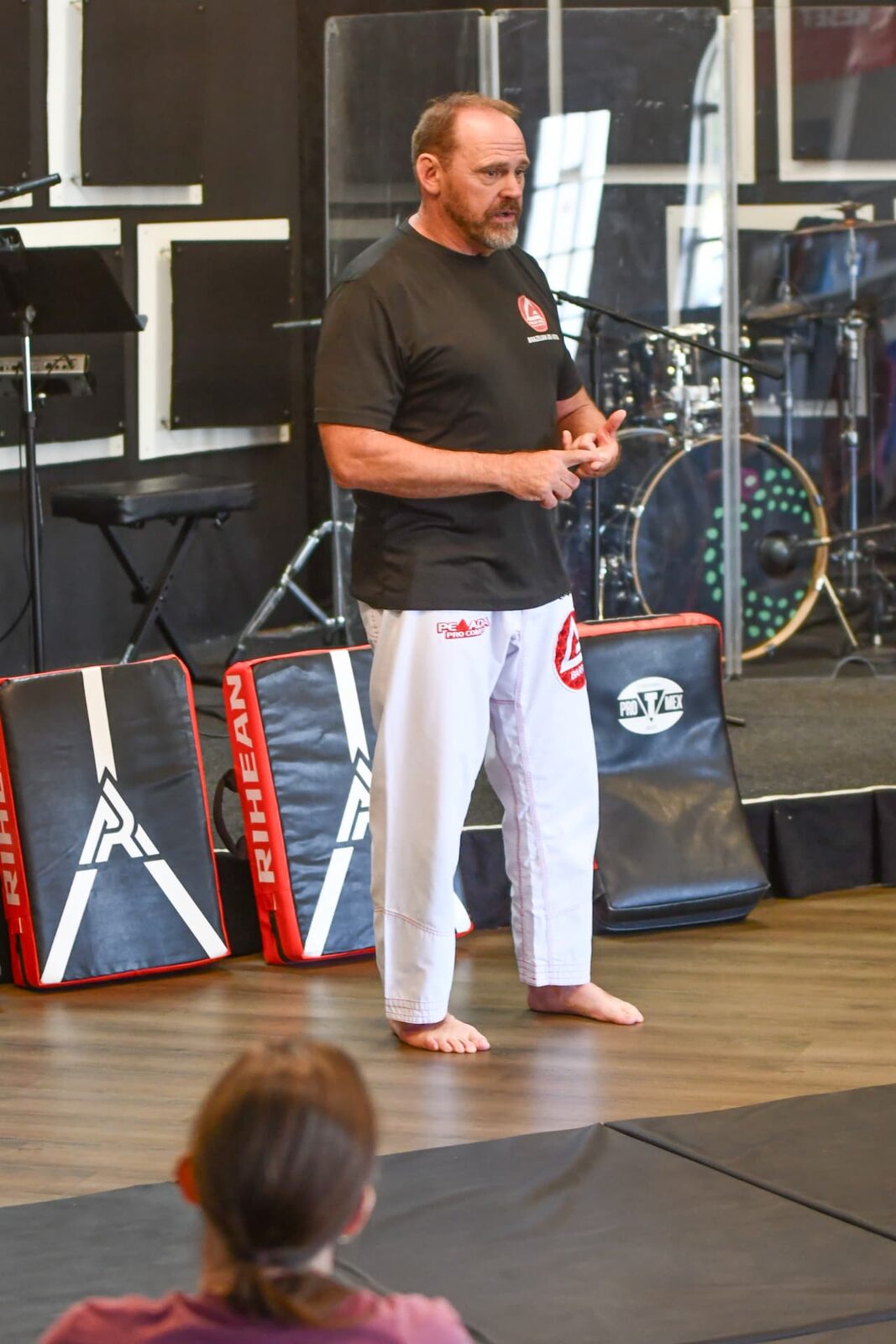 Dave teaching a group on the mats